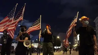 Protesters singing the American national anthem