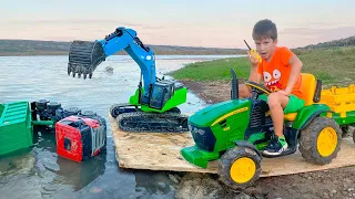 Darius riding his tractor in the mud and saving some car drivers from water | Kids Adventure