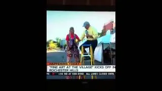 Channel 7 Detroit reporter LOVES stilt-walkers