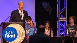 Biden makes two jokes about hugging consent at IBEW Conference