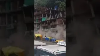 Moment landslide crushes buildings in India