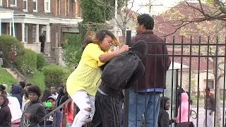 ORIGINAL: Mother drags son from Baltimore riots