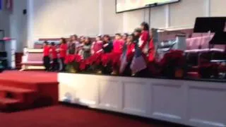 Kids choir singing O' Come All Ye faithful