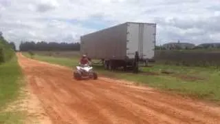 Raptor 660 with dual exhaust vs Yamaha YFZ with paddle tires drag race blowout