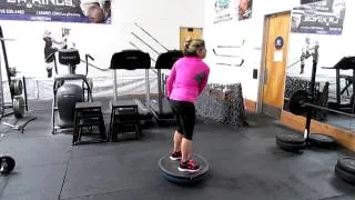 Medicine ball chops on hard side up bosu