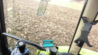 Claas Axos ploughing