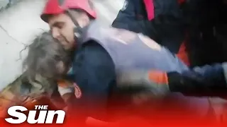 Moment rescuers pulls five-year-old girl alive from the wreckage in Syria