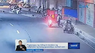 Pagtangay ng riding-in-tandem ng cellphone ng isang guwardiya, na-huli cam | Saksi