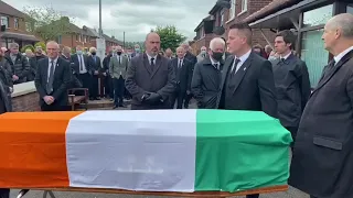 Tricolour placed on coffin of Bobby Storey