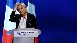 Le Pen lashes out at rivals as Macron tops latest polls