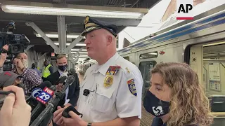 Police: commuters held up phones as woman raped