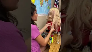 She kept putting her hair on her desk so she cut it!