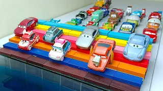 Disney Cars miniature car rolls down colorful rainbow-colored stairs and falls into the blue water