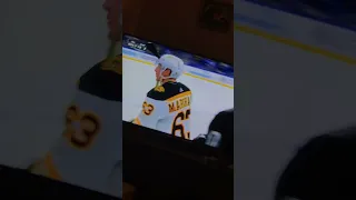 Corey Perry high sticks Brad Marchand at the bench area after brad scores