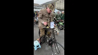 Man starts and rides a 1902 Clement Garrard motorcycle