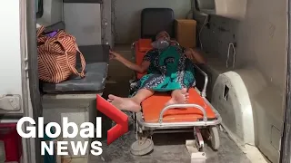 Indian hospital slammed by COVID-19 crisis as some patients treated in ambulances