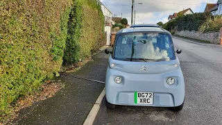 Citroen Ami charging across a pavement