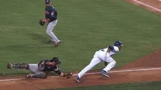 Escobar avoids tag in rundown, steals home