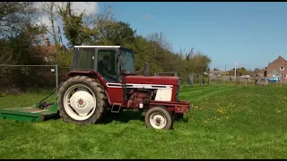 International 784 cutting grass