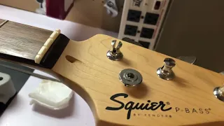 Changing a broken bone nut on a Bass Guitar