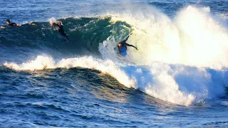 Bodyboarders scoop hard to race fast barrels