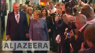 German elections: Angela Merkel wins fourth term as far-right AfD surges