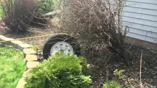 Pulling out a bush using a spare tire