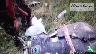 Footage Released on MH17 Anniversary Shows Rebels Looting Dead Passengers' Bags