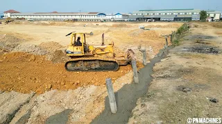 Komatsu D53 Bulldozer Pushing Soil & Clearing mud Efficiently With a 5Ton Truck For Transport