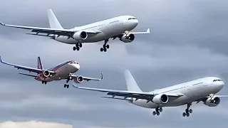 Close up view of large planes landing together