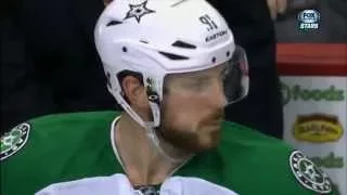 Equipment manager feeds Tyler Seguin chocolate on the bench after goal