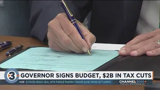 Evers signs GOP-written state budget with $2 billion tax cut