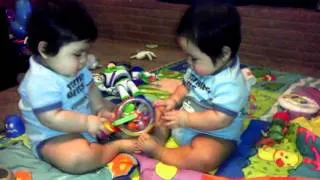 Twin babies play, then fight!