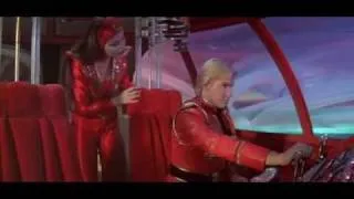 Princess Aura teaches Flash Gordon how to pilot a spaceship