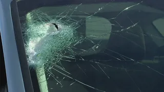 Rock thrown on I-25 damages woman's windshield