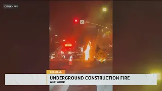 Video shows flames coming out of the street from a Westwood underground fire