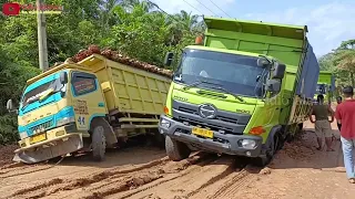 Truk sawit libas jalur jalan sempit licin begini jadinya.