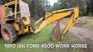 Old Backhoe Fishing For Logs