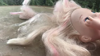Cutting a baby doll’s hair