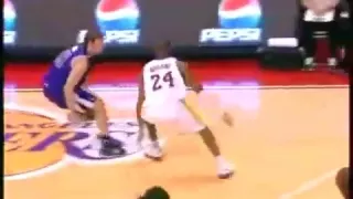 Kobe Bryant gets crossed and falls