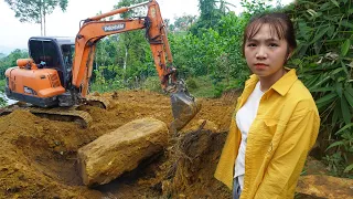 The excavator repaired the road up the mountain - Helped scoop the land to prepare build a house