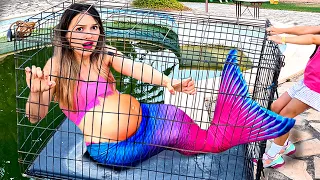 The pregnant mermaid is locked in a cage over the toxic pool!