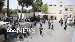 Funeral procession for Shireen Abu Akleh disrupted by Israeli police violence