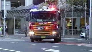 Fire & Rescue + Ambulance + Police Units Responding Fast to an Emergency in Sydney CBD