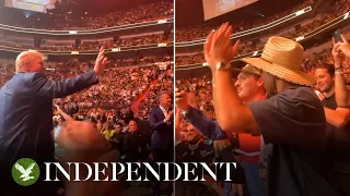 Crowd chants 'U-S-A' as Donald Trump turns and waves at UFC 287 in Miami