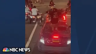 Viral video shows biker smash windshield, then pull gun on driver