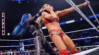 Sasha Banks brutalizing Charlotte Flair