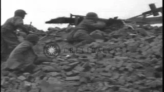 US soldiers firing machine guns and a German Panther tank is fired on and erupts ...HD Stock Footage