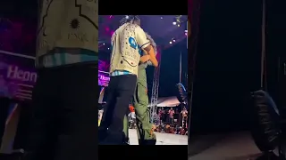 Popcaan and Toni-ann Singh embrace at Burna Boy concert in Jamaica