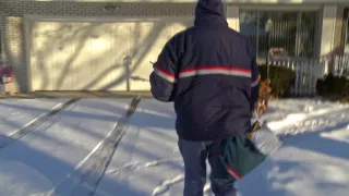 UNITED STATES POSTAL WORKER IN THE VERY COLD.